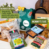 The image displays a gift set titled 'Mommy's Fave' from Quisina, featuring a thermal gift bag. The set includes various pre-packaged meals such as Salisbury Steak with Mushroom gravy, Chicken Spinach Pops, Italian Sausage Pops, Buttermilk Chicken Nuggets, and Chili con carne, all sealed in individual serving packages.