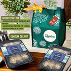 The image shows a green thermal gift bag with 'Dimsum Delight' written on it, alongside packaged food items presumably containing Scallop & Pork Siomai and Chicken & Sausage Siomai. There is also a decorative flower and a tag with a price label in the background.