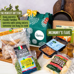 The image displays a gift set titled 'Mommy's Fave' from Quisina, featuring a thermal gift bag. The set includes various pre-packaged meals such as Salisbury Steak with Mushroom gravy, Chicken Spinach Pops, Italian Sausage Pops, Buttermilk Chicken Nuggets, and Chili con carne, all sealed in individual serving packages.