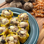 A plate of prepared Scallop & Pork Siomai, with ingredients like pork, mushrooms, and scallops visible in the background.